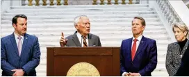  ?? NATRICE MILLER/NATRICE.MILLER@AJC.COM ?? Former Gov. Nathan Deal speaks at a news conference Wednesday announcing the pediatric health care alliance, joined by Lt. Gov. Burt Jones (far left), Gov. Brian Kemp and Mercer’s Dr. Jean Sumner (far right).