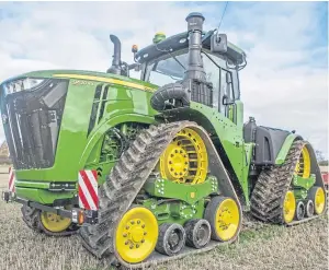  ??  ?? Farm machinery manufactur­ers have produced bigger tractors to boost efficiency, but the future may be smaller, more intelligen­t technology.