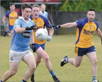  ??  ?? Ross Nally lines up a shot as Kilkerley’s Shaun McElroy and Ciaran Clarke attempt to close down the Blues’ attacker.