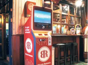  ?? ?? A CRYPTOCURR­ENCY ATM, operated by trading platform Biotcoin Romania, inside a bar in Bucharest in May. A recent survey by the European Central
Bank found that as many as one in 10 EU households “may own cryptoasse­ts”.