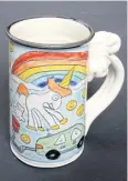  ?? TOM EDWARDS POTTERY VIA AFP ?? This undated handout photo courtesy of Tom Edwards Pottery shows the ‘Farting Unicorn’ on one of his mugs.