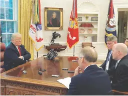  ??  ?? OVAL OFFICE INTERVIEW – US President Donald Trump answers question from Reuters reporters Steve Holland, Jeff Mason and James Oliphant as White House Press Secretary Sarah Huckabee Sanders listens during an interview with Reuters in the Oval Office of the White House in Washington, US August 20, 2018. (Reuters)