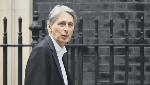  ?? PICTURE: CHRIS J RATCLIFFE ?? Philip Hammond claimed GDP could fall and borrowing could reach £80bn more a year by 2033/34