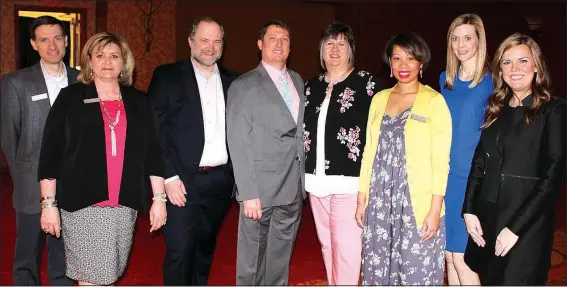  ?? NWA Democrat-Gazette/CARIN SCHOPPMEYE­R ?? James Vawter (from left), Cookie Parker, Brian Looney, Kent and Becky Shaffer, Raynisha Robinson, Sarah Gillmer and Lisa Chambers, Saving Grace board members, welcome guests to the Butterflie­s and Blooms benefit luncheon April 19 at the John Q. Hammons...