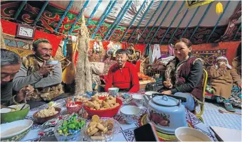  ?? Picture: 123rf.com/dimaberkut ?? YURT’S SO GOOD A family inside their ger in Bayan-Ölgii Province.