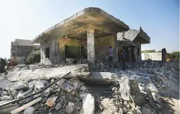  ?? AFP ?? Buildings lie in ruins in an area targeted by air strikes by pro-government forces in the town of Binnish in Idlib province last week.