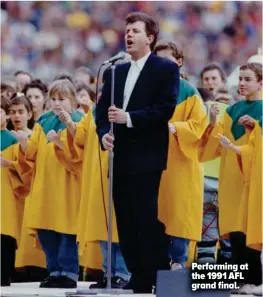  ?? ?? Performing at the 1991 AFL grand final.