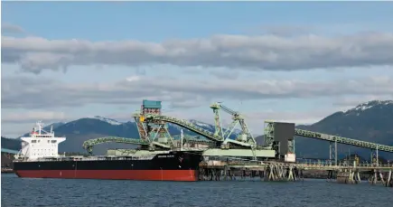  ?? CP FILE PHOTO ?? The bulk carrier Unicorn Ocean is seen loading coal at Ridley Terminals in Prince Rupert on March 8, 2013. The federal government is looking to sell the Crown-operated coal terminal.