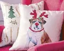  ??  ?? Festive throw pillows