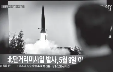  ??  ?? A MAN watches a television news screen showing a file footage of a North Korean missile launch, at a railway station in Seoul. North Korea fired two short-range missiles into the sea South Korea’s Joint Chiefs of Staff said, after warnings from Pyongyang over military exercises between Washington and Seoul next month. AFP PHOTO