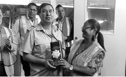  ??  ?? Captain Vakchos Charalampo­s of the M/V Cape Tainaro Voy.3 is presented with a token by Sjaun Morrison, sales and marketing Manager of Carib Star Shipping Ltd, during a customer engagement event in December 2019.