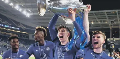  ??  ?? Chelsea's matchwinne­r Kai Havertz llifts the trophy with Timo Werner following victory in the UEFA Champions League final victory.