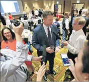  ?? Chris Neal Topeka Capital-Journal ?? TRUMP FAVORITE Kris Kobach speaks with the media at his primary election watch party in Topeka.