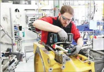  ?? GOOGLE ?? A worker at agricultur­e manufactur­er AGCO uses Glass to see assembly instructio­ns, make reports and get remote video support.