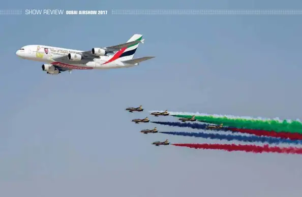  ??  ?? The 100th A380 delivered by Airbus to Dubai-based Emirates leads a formation of the Al Fursan aerobatic display team as an opening aerial presentati­on at Dubai Airshow 2017
