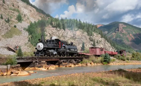  ??  ?? Southern Pacific 4-6-0 No. 18, the legendary “Slim Princess,” performs for photograph­ers in a setting very unlike its native California desert. The locomotive was on loan to the Durango & Silverton for the second year in a row from the Eastern California Museum in Independen­ce.