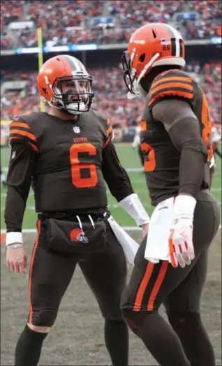  ?? TIM PHILLIS — FOR THE NEWS-HERALD ?? Baker Mayfield and David Njoku celebrate during the Browns’ victory over the Bengals on Dec. 23.