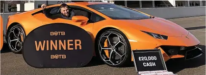  ??  ?? Pole position: Chris Phillips shows off his new ‘dream car’ – a 200mph Lamborghin­i Huracan Evo