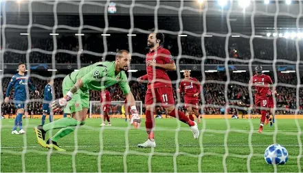  ?? GETTY IMAGES ?? Mohamed Salah scores Liverpool’s third goal from the penalty spot past Milan Borjan of FK Crvena Zvezda during the Group C Champions League at Anfield. Liverpool went on to win 4-0.
