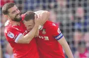  ?? JACOB KING / ASSOCIATED PRESS ?? Wrexham’s Paul Mullin, right, celebrates with Elliot Lee after scoring during Saturday’s match in Wrexham, England.