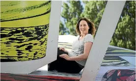  ?? PHOTO: JOSEPH JOHNSON/STUFF ?? Helen Trappitt sits on the art installati­on ‘‘Call Me Snake’’, which is opposite the Margaret Many playground on Manchester St. Helen has combined her engineerin­g skills to help people involved in SCAPE Public Art install sculptures and artworks around...