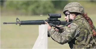  ?? RYAN JACKSON/EDMONTON JOURNAL ?? Sgt. Tatyana Danylyshyn, a 29-year-old reservist from Victoria, B.C., ranks among the world’s best at aiming a military assault rifle.