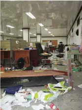  ??  ?? A ransacked office