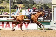  ?? Associated Press ?? Taiba and jockey Mike Smith ride to a win in the Santa Anita Derby on April 9.