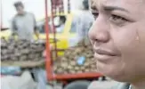  ??  ?? CUCUTA: Venezuelan Maria Florez cries during an interview with AFP in the La Parada neighborho­od in Cucuta, Colombia, near the Simon Bolivar Internatio­nal Bridge, on the border with Tachira, Venezuela. Venezuelan­s cross to Colombia to buy groceries due to the shortages in their country. —AFP