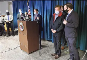  ?? Arnold Gold / Hearst Connecticu­t Media ?? U.S. Sens. Richard Blumenthal, at the podium, and Chris Murphy, right, said Saturday, they are self-isolating after appearing at a press conference with Gov. Ned Lamont, center, the day before. On Friday, Lamont begin the process of self-quarantini­ng, after his chief spokesman, Max Reiss, tested positive for COVID-19.