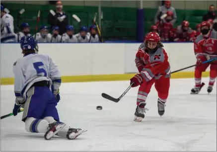  ?? AIMEE BIELOZER — FOR THE NEWS-HERALD ?? Mentor’s Andrew McBride shoots against Gilmour on Feb. 27on the sequence in double overtime that led to the game-winning goal.