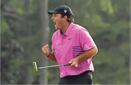  ?? MICHAEL MADRID/USA TODAY SPORTS ?? Patrick Reed celebrates after making a par putt on the 18th green to win the 2018 Masters tournament.