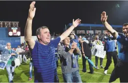  ??  ?? Champion...Gheorghe Hagi celebrates