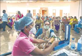  ??  ?? Beneficiar­ies undergo check up before being administer­ed the Covid-19 vaccine at the Government Omandurar Medical College Hospital, in Chennai on Wednesday.