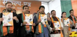  ?? — G.N. Jha ?? City BJP president Manoj Tiwari with Union ministers Nitin Gadkari, Prakash Javadekar, MPs Meenakshi Lekhi and Gautam Gambhir at the launch of ‘sankalp patra’ for Assembly election in New Delhi on Friday.