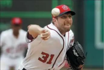  ?? ALEX BRANDON — THE ASSOCIATED PRESS ?? On his way to another brilliant outing, Nationals starter Max Scherzer uncorks a pitch during the second inning Sunday against the Phillies. Scherzer eventually was knocked out of the game amid a Phils rally, but they blew it in the bottom of the ninth...