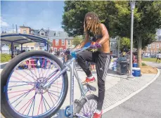  ??  ?? Bikers show off their talents during the the Stop the Violence block party in Allentown.