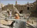  ?? AMR NABIL — THE ASSOCIATED PRESS ?? Workers restore the Al Sarreha Mosque in the 18th century Diriyah fortified complex, that once served as the seat of power for the ruling Al Saud, in Riyadh, Saudi Arabia.