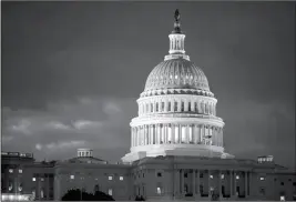  ?? ASSOCIATED PRESS ?? IN THIS APRIL 4 FILE PHOTO, the Capitol is seen at dawn in Washington. Top Capitol Hill negotiator­s are reporting progress toward a long-sought agreement on a massive $1 trillionpl­us spending bill that would fund the day-to-day operations of virtually...