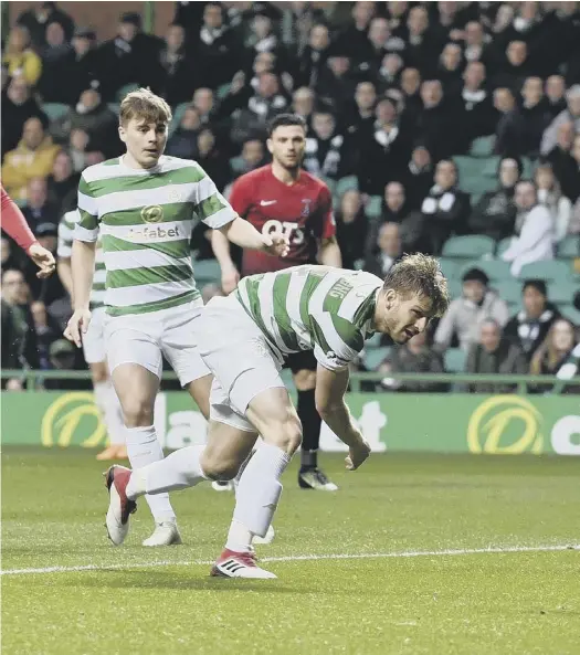  ??  ?? 0 Celtic midfielder Stuart Armstrong watches as Kilmarnock goalkeeper Jamie Macdonald dives to save his close-range effort during