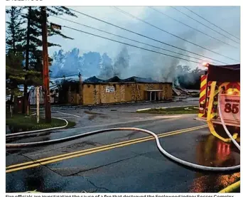  ?? DEANGELO BYRD / STAFF ?? Fire officials are investigat­ing the cause of a fire that destroyed the Englewood Indoor Soccer Complex on Tuesday morning. The fire burned for hours before it was discovered, officials said.