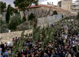  ?? ?? In the above photos, Christians walked on the Mount of Olives in East Jerusalem,