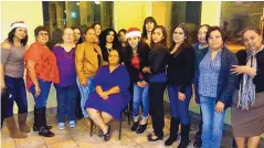  ?? COURTESY OF THE ALVAREZ FAMILY ?? Kathy Alvarez, owner of the Kathy’s Carry Out in the South Valley, is surrounded by her employees in this 2019 photo.