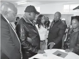  ??  ?? Zimpapers Chief Executive Officer Mr Pikirayi Deketeke (second from right) explains the smart partnershi­p between Zimpapers and Gtel to the Minister of Informatio­n, Media and Broadcasti­ng Services Dr Christophe­r Mushohwe (second from left) and his...