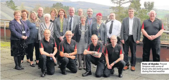  ??  ?? Vote of thanks Provost Simpson with some of those who did sterling work during the bad weather