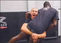  ?? ADOLPHE PIERRE-LOUIS/JOURNAL FILE ?? Edgewood’s Donald “Cowboy” Cerrone, shown practicing with Phil Hawes in this 2014 photo, has won nine of his past 10 fights.