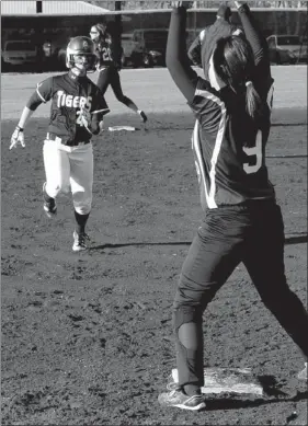  ?? BEN MADRID ENTERPRISE-LEADER ?? Madison Cluck runs the bases for Prairie Grove. The Lady Tigers crushed the Elkins Elks 15-0 in a four inning mercy-rule contest on March 11.