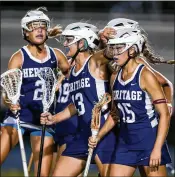  ?? RICHARD GRAULICH / THE PALM BEACH POST ?? American Heritage’s Megan Mangines (13)congratula­tes Caitlyn Wurzburger (15) after she scored against Lake Highland Prep at Boca Raton High School on Friday night.