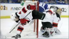  ?? CHRIS O’MEARA — ASSOCIATED PRESS ?? New Jersey Devils defenseman Sami Vatanen, left, collides with goaltender Keith Kinkaid, allowing a goal by Tampa Bay Lightning right wing Nikita Kucherov during the second period of Saturday’s playoff game in Tampa, Fla.