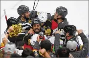  ?? AP ?? Players try separating Vegas Golden Knights right wing Ryan Reaves, Montreal Canadiens defenseman Joel Edmundson and Canadiens right wing Joel Armia during Game 2 of the Stanley Cup semifinal series Wednesday.